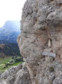 Close-up of rock formation on mountain against sky