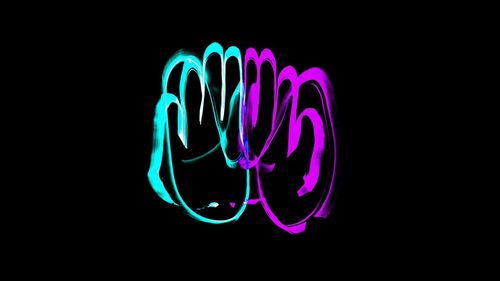 Close-up of light painting against black background