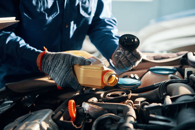 Midsection of man working in workshop