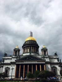 Low angle view of cathedral against cloudy sky