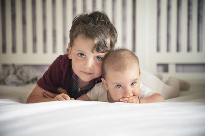 Portrait of father and son at home