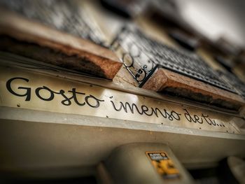 High angle view of text on old metal