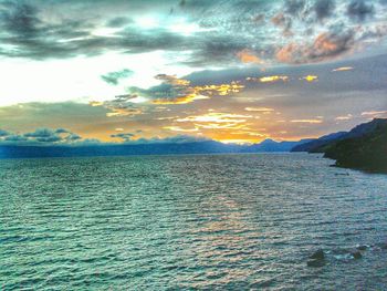 Scenic view of sea against cloudy sky