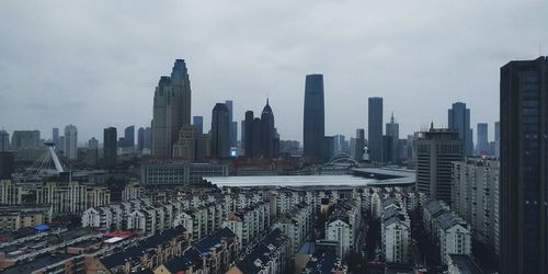 Modern buildings in city against sky