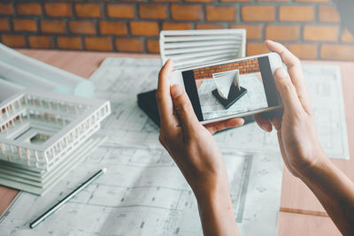 Close-up of man using mobile phone