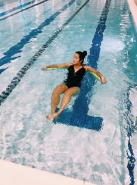 High angle view of man swimming in pool