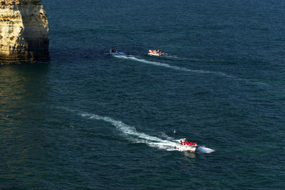 High angle view of boats in calm blue sea