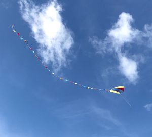 Low angle view of airshow against sky