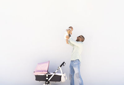 Father lifting his little baby