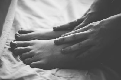 Close-up of woman touching feet