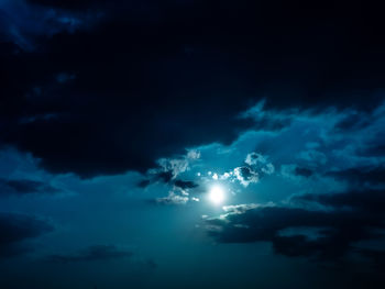 Low angle view of moon in sky at night