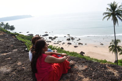 Woman looking at sea shore