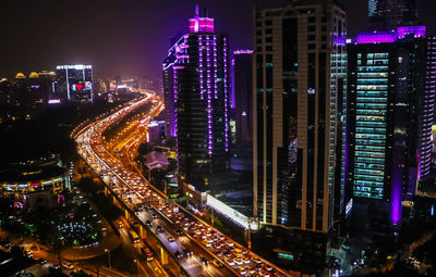 High angle view of illuminated city at night