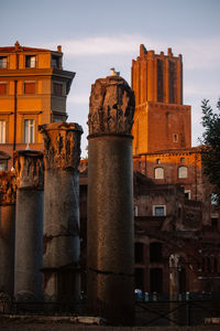 Low angle view of columns against sky