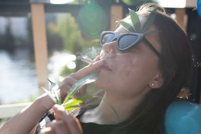 Close-up of woman smoking cigarette