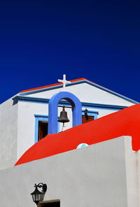 Low angle view of church against clear blue sky