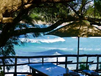 Scenic view of swimming pool by sea against sky
