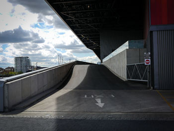 Bridge in city against sky