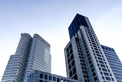 Low angle view of skyscrapers against clear sky