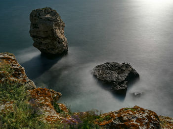 High angle view of rock formation in sea