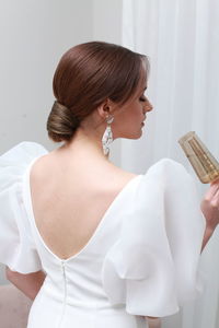 Rear view of woman with iv drip