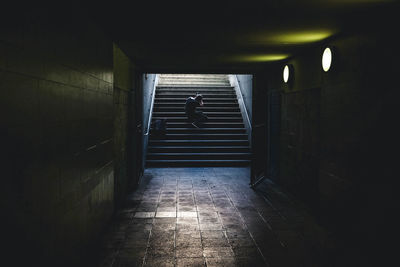 Man sitting on staircase 