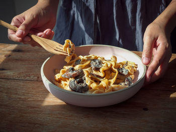 Midsection of man preparing food