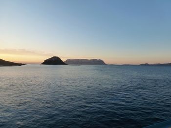 Scenic view of sea against sky at sunset