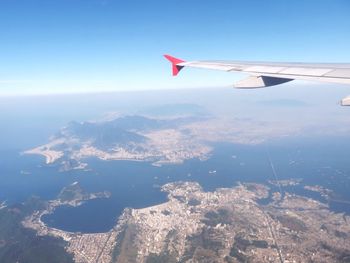 Cropped image of airplane flying over landscape