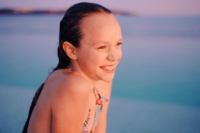 Portrait of beautiful young woman at beach