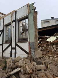 Low angle view of abandoned building against sky