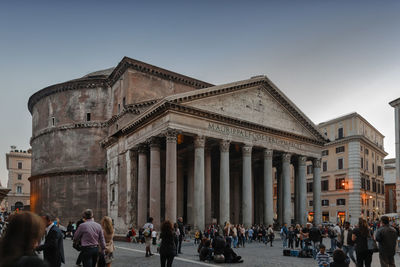 Group of people in front of historical building