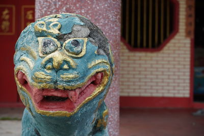 Lion statue in front of the shrine in kathu district, phuket province.