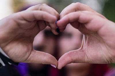 Cropped hand of woman holding hands