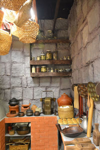 Illuminated electric lamps hanging on wall at home