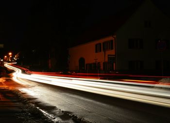 Blurred motion of car moving on road at night