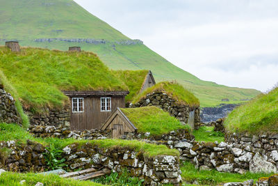 Built structure on landscape against sky