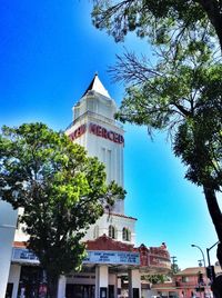 Low angle view of buildings against blue sky