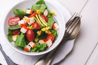 High angle view of salad in bowl on table