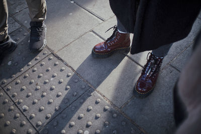 Low section of person standing on street