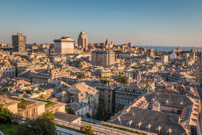 High angle view of buildings in city against clear sky