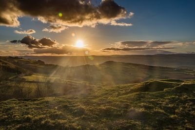 Scenic view of landscape against sky during sunset
