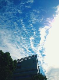 Low angle view of building against cloudy sky