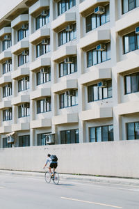 Man riding bicycle in city