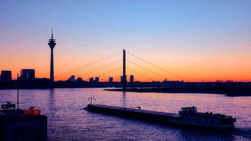 View of bridge over river against sky during sunset