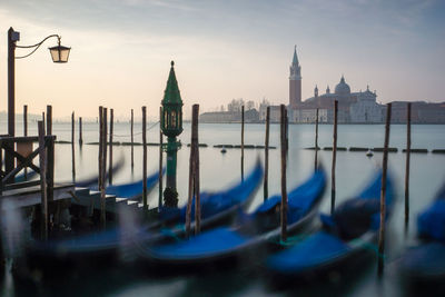 Church of san giorgio maggiore in grand canal with gondola against sky