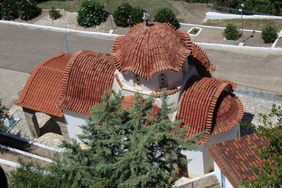 High angle view of trees and houses against building