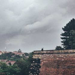 Low angle view of building against cloudy sky