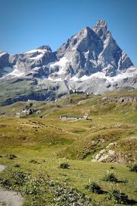 Scenic view of snowcapped mountains against clear sky