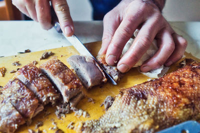 Close-up of person preparing food on table